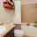 a bathroom with a tub sink and toilet