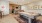 a large kitchen with a bar and a pool table