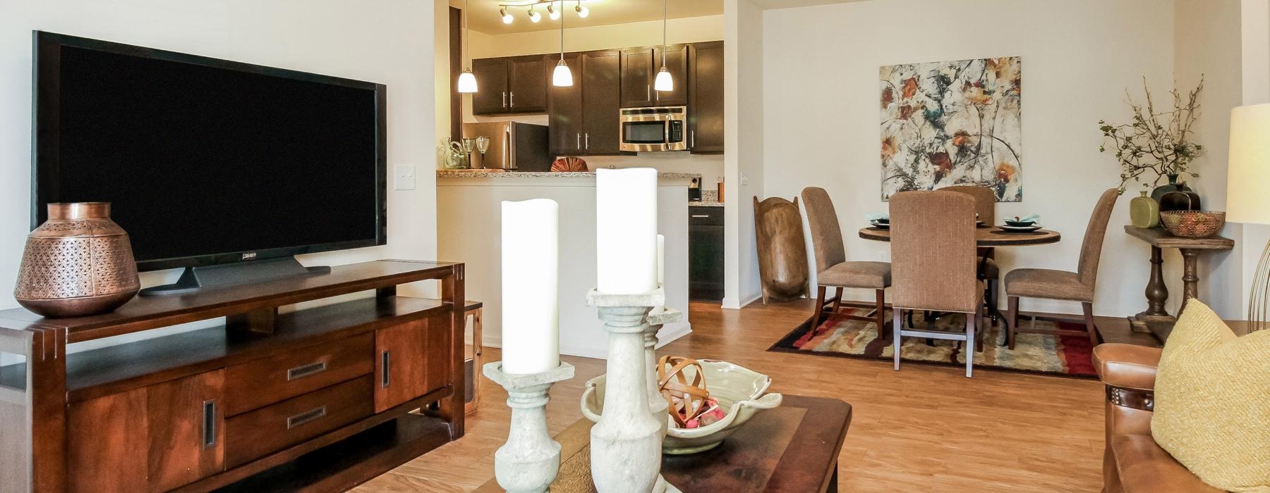 a living room with a tv and dining table