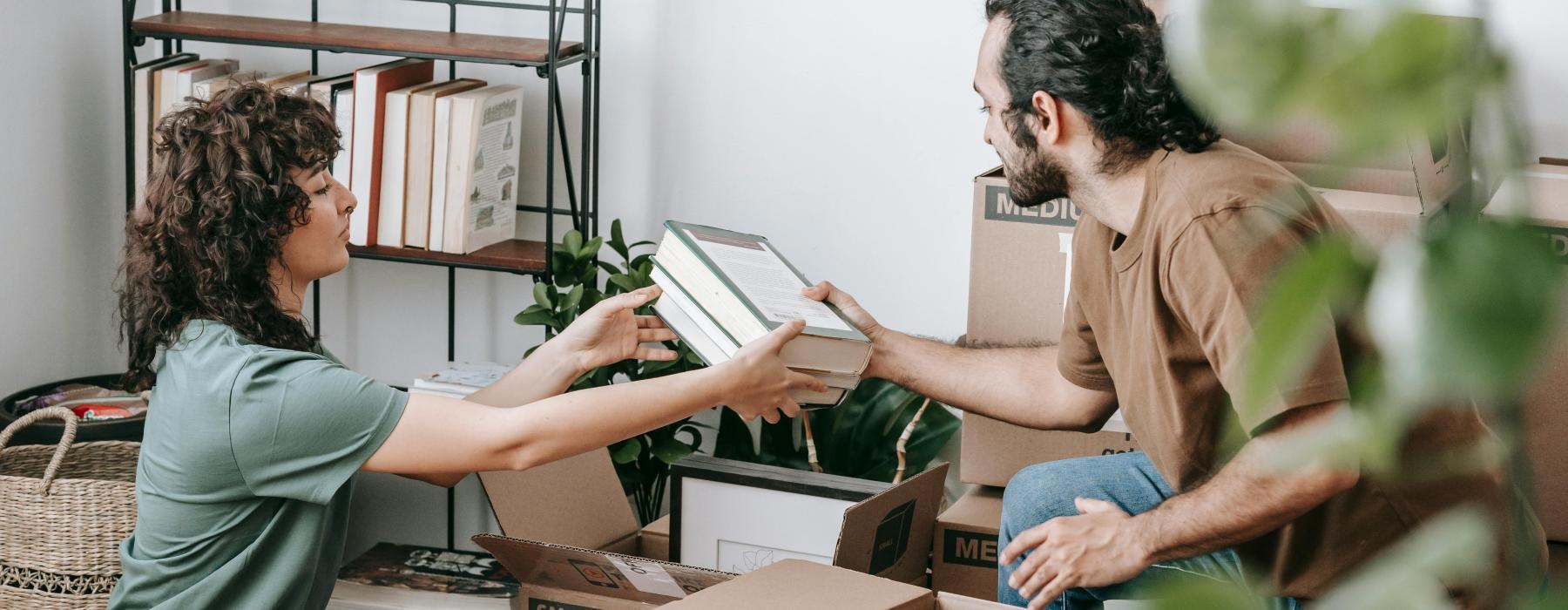 a man and a woman sitting on boxes