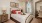a bed with red pillows