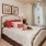 a bed with red pillows