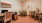 a room with a desk and chairs