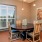 a dining room with a table and chairs