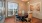 a dining room with a table and chairs